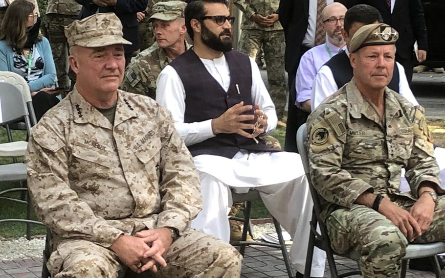 U.S. Marine Corps Gen. Frank McKenzie, left, sits near Gen. Scott Miller in Afghanistan on Monday, July 12, 2021.