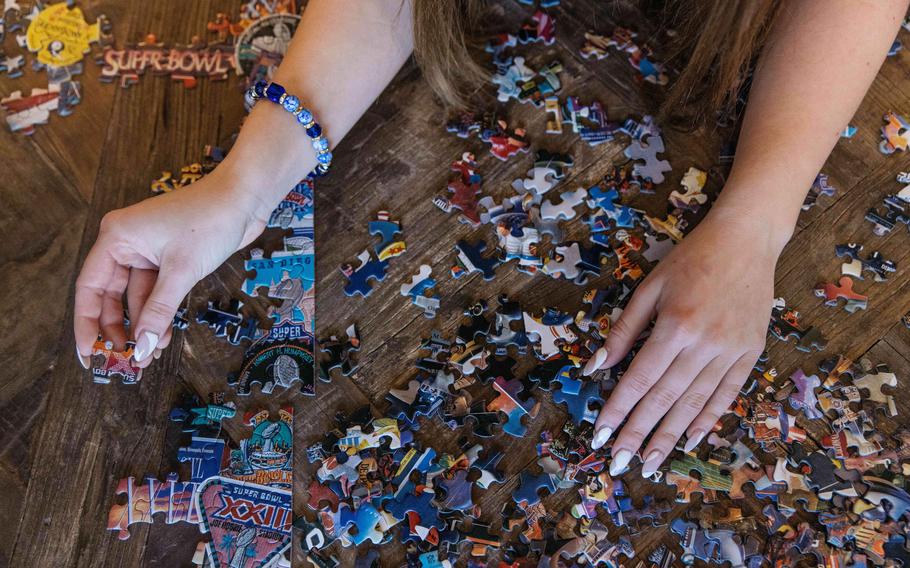 Annalise Stacey works on a puzzle. 