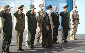 In this picture released by the official website of the office of the Iranian supreme leader, Supreme Leader Ayatollah Ali Khamenei, center, attends a graduation ceremony of a group of armed forces cadets accompanied by commanders of the armed forces, at the police academy in Tehran, Iran, Monday, Oct. 3, 2022. 