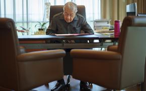 Malaysia's former Prime Minister Mahathir Mohamad reads document at his office in Kuala Lumpur, Malaysia, Friday, Aug. 19, 2022. Mahathir expects Malaysia’s graft-tainted ruling party will hold general elections in coming months, and could win big, but the nonagenarian reformer vowed Friday that he would fight "even a losing battle" on principle. (AP Photo/Vincent Thian)