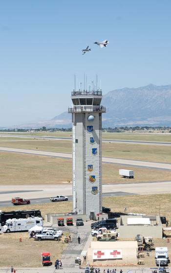 Crowds gather to watch an F-35A Lightning II fly side by side with a P-51 Mustang as part of a heritage flight at the Warriors over the Wasatch air show at Hill Air Force Base, Utah, June 29, 2024. 