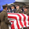 A casket holding the remains of U.S. Army Air Forces Staff Sgt. Robert Ferris Jr. is carried from a plane at Raleigh-Durham International Airport, N.C., May 16, 2024.