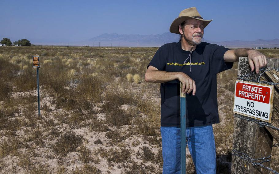 Webmaster Joerg Arnu stands on his property on Sept. 17, 2020, in Rachel, Nevada, where he creates websites including the one adverse to Alienstock.