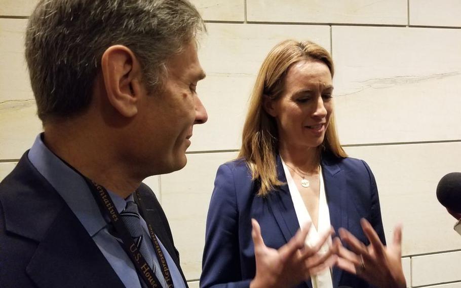 Reps.-elect Tom Malinowski, left, and Mikie Sherrill, talk to reporters from New Jersey news outlets during freshman orientation in Washington.