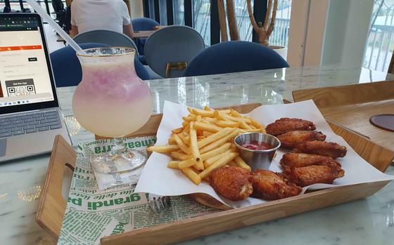 Chicken wings, french fries and lemonade at Ten Dogs Café in Pyeongtaek, South Korea.