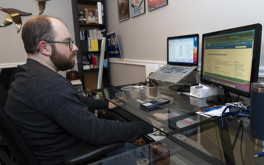 Ethan Miller works on his taxes at home in Silver Spring, Md., Friday, Jan., 21, 2022. 