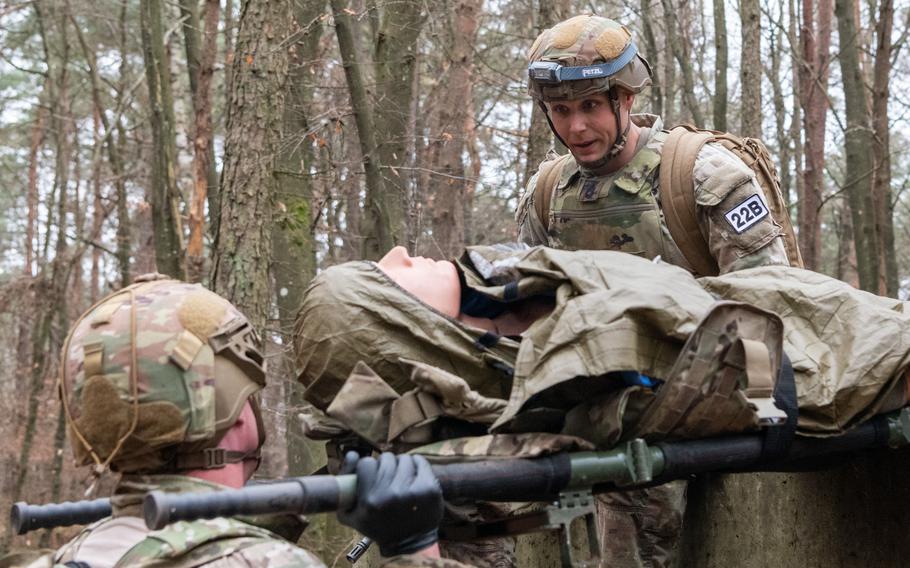 Two American soldiers participate in a medical competition.