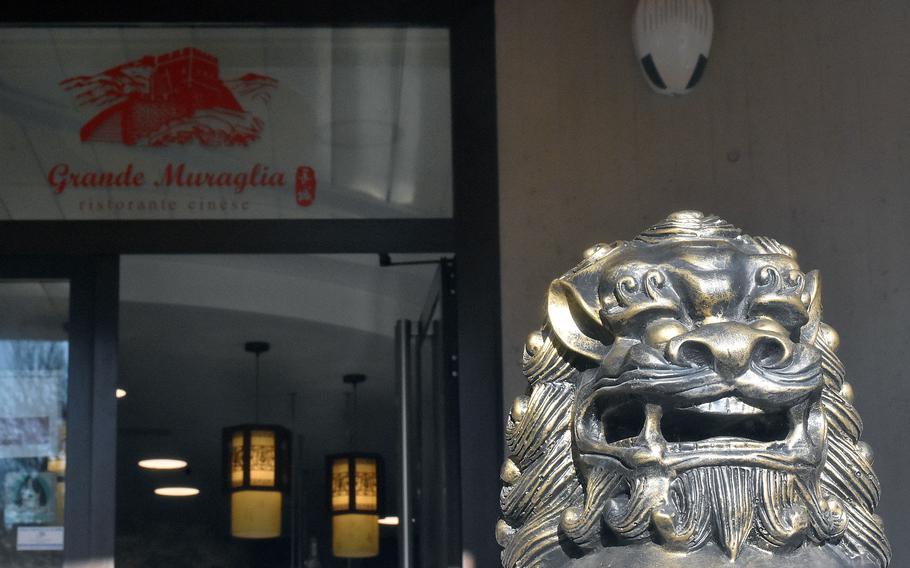 A sculpture guards the entrance to the Grande Muraglia restaurant in Sacile, Italy.