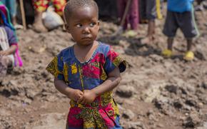 Pasika Bagerimana's daughter Mahigwe stands outside a temporary shelter she shares with others who fled fighting, in Nyiragongo, Democratic Republic of Congo, Aug. 31, 2022. 