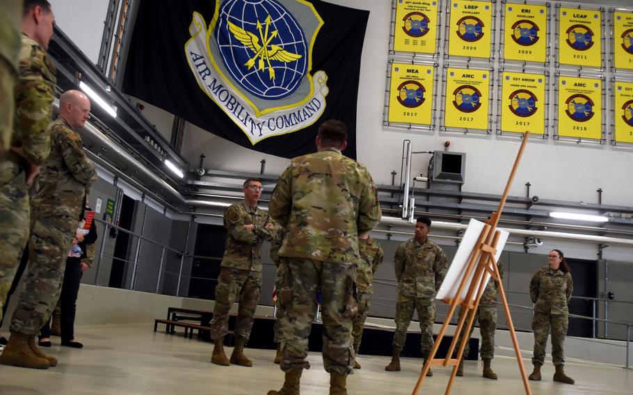 Maj. Gen. John Klein, commander of the Air Force Expeditionary Center, center left background, visits with members of the 521st Air Mobility Operations Wing at Ramstein Air Base in Germany on Feb. 23, 2023. Klein met with air mobility personnel in Europe and the Pacific theater in February and March to see what challenges they are facing.