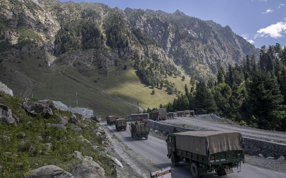 An Indian army convoy moves on the Srinagar- Ladakh highway at Gagangeer, northeast of Srinagar, Indian-controlled Kashmir on Sept. 9, 2020. Indian and Chinese army commanders met Sunday, Oct. 10, 2021, and discussed steps to disengage troops from key friction areas along their disputed border to ease a 17-month standoff that has sometimes led to deadly clashes, an Indian army spokesman said. 