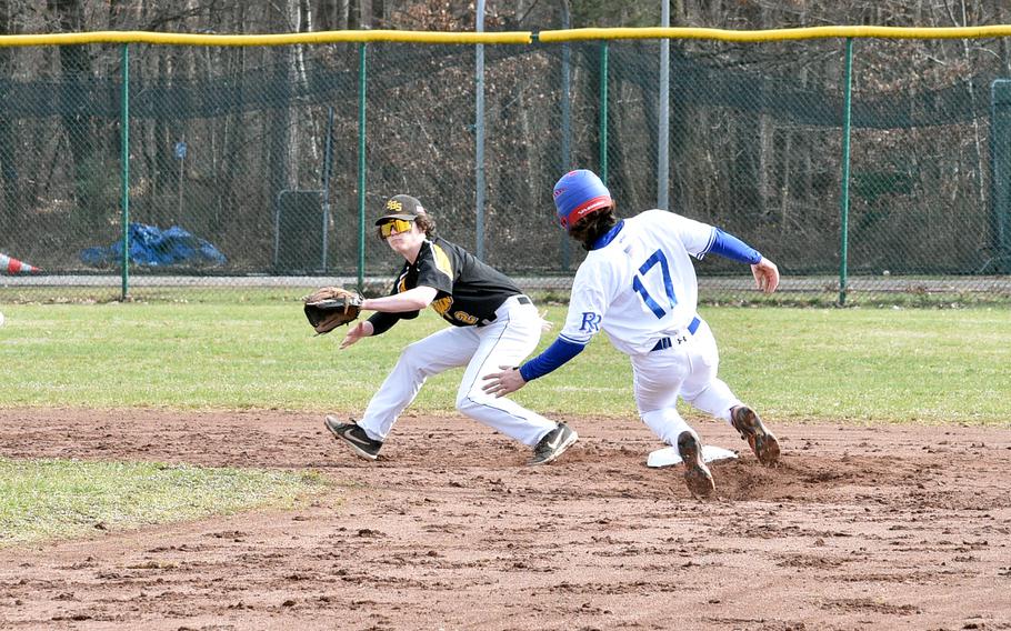 Stuttgart’s Blake Rossignol steps off second base to receive a throw as Ramstein’s Jaxon Lundell slides during the first game of a doubleheader on the baseball field near Southside Fitness Center on Ramstein Air Base, Germany. The two schools often meet with the D-I baseball championship on the line.