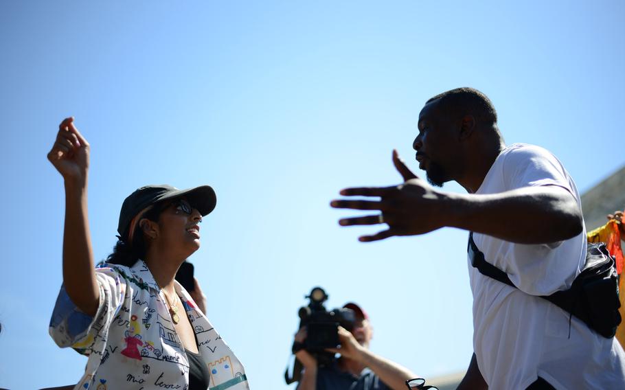 An abortion rights activist, left, interacts with an antiabortion activist outside the Supreme Court on Saturday, June 25, 2022.