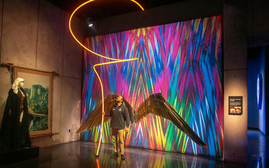 Tour guide John Kourounis lights up Wonder Woman’s Lasso of Truth, one of the new interactive exhibits that will be available to visitors who go on the Warner Bros. Studio Tour in Burbank, Calif. 