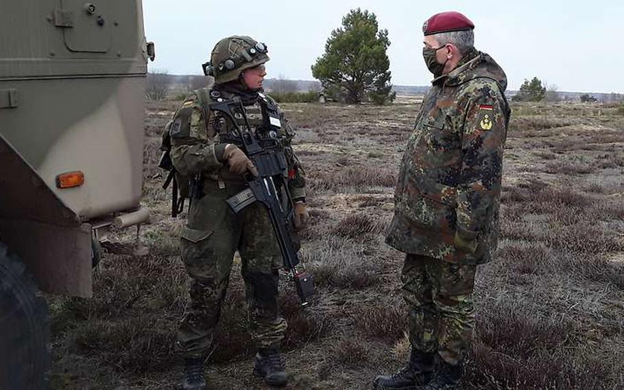 Lt. Gen. Alfons Mais, the chief of the German army, right, visits troops of the Mountain Infantry Battalion 232 in Bischofswiesen, Bavaria, in March 2021, before the unit deployed to Mali. 