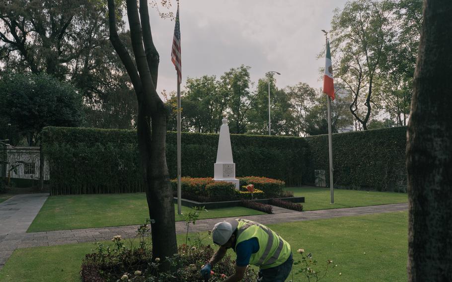 Workers at the U.S. National Cemetery in Mexico City clean planters near a memorial honoring 750 unidentified U.S. soldiers killed in the 1846 U.S. invasion of Mexico.