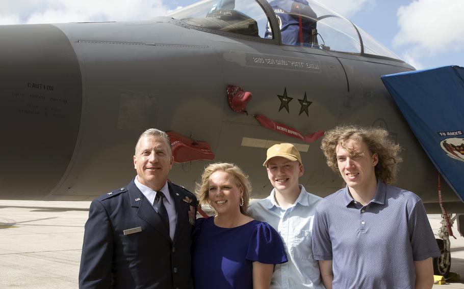 Brig. Gen. David Eaglin, the newly minted 18th Wing commander, poses with his family near an F-15C Eagle bearing his name at Kadena Air Base, Okinawa, Friday, July 16, 2021.