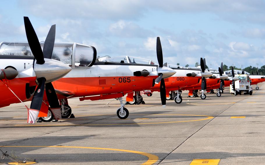 A row of T-6B Texan II aircraft on the flight line at Naval Air Station Whiting Field, Fla., in 2014. 