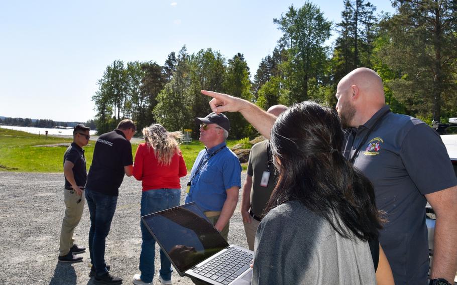 U.S. and Norwegian military representatives discuss future projects during a site visit at Rygge Air Station in Norway on May 23, 2024. 