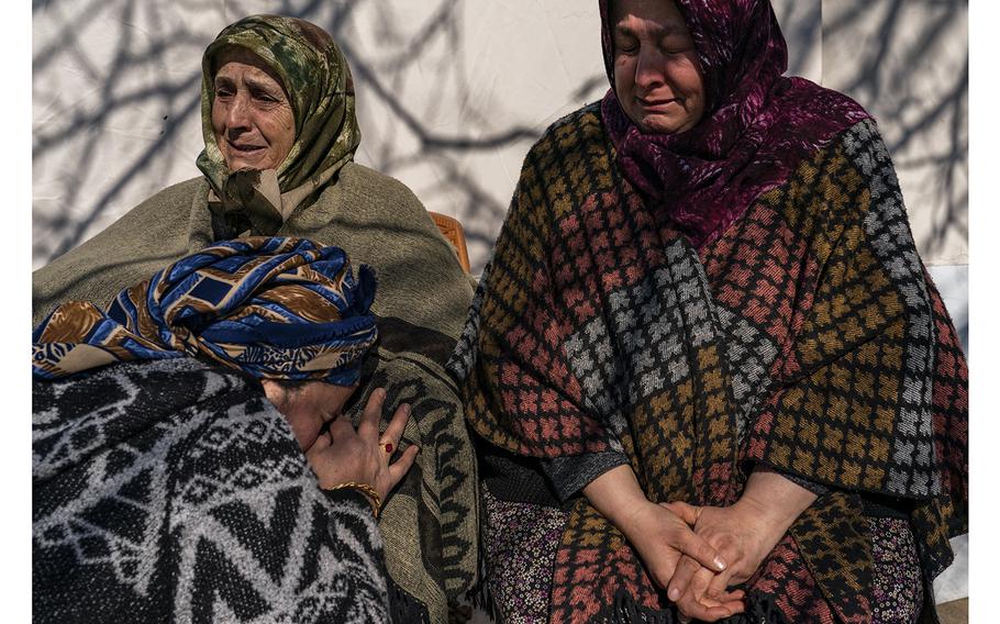 Relatives of Sakine Demir grieve at their home in the village of Colaklar, near Islahiye, Turkey, on Feb. 12, 2023. Demir and her youngest daughter, Semra, have been missing since earthquakes hit Turkey and Syria on Feb. 6, collapsing Demir’s home in Islahiye. 