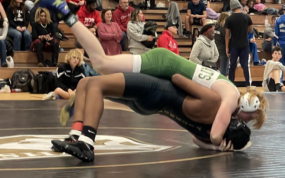 David Tarso of Naples High School attempts to turn Vicenza’s Jayden Murray during the Vicenza Italian Medallion Battle “Uno” wrestling tournament at Vicenza High School, Italy, January 13, 2024. Tarso won the match by pin.



 