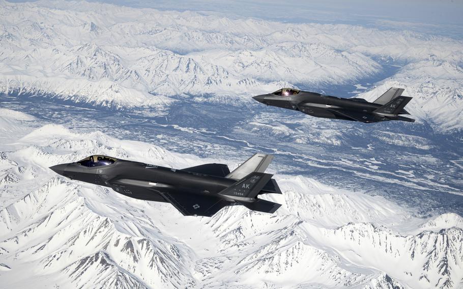 Two Air Force F-35A Lighting IIs assigned to the 354th Fighter Wing fly over the Joint Pacific Alaska Range Complex, April 14, 2022. 