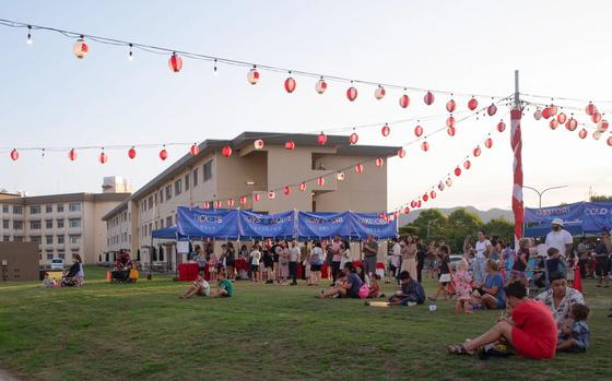 Attendees enjoy the food and festivities of the Bon Odori festival at Marine Corps Air Station Iwakuni, Japan.