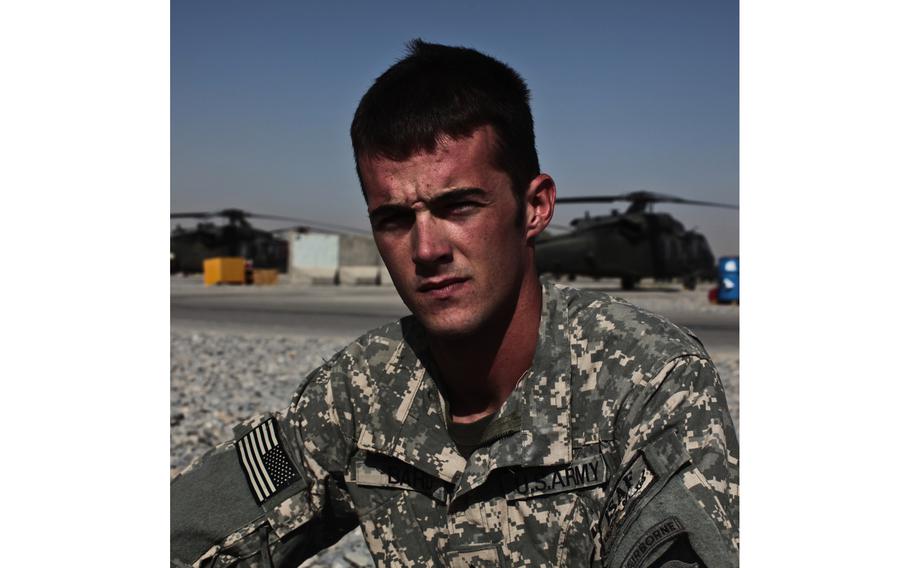 A soldier looks for a photo