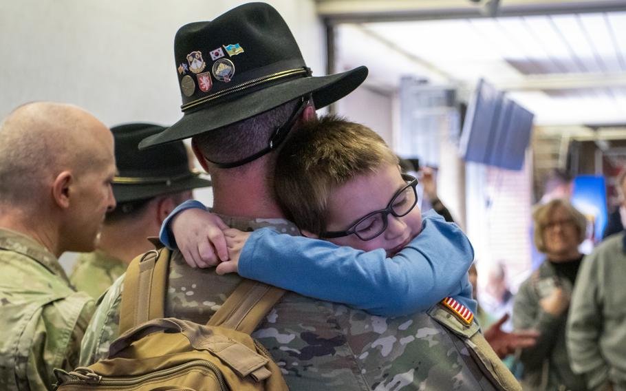 Maj. Cody Cade embraces his son, Wyatt, 5, while being welcomed home Jan. 13, 2024, at Eppley Airfield in Omaha, Neb.