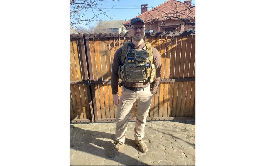 Washington Iraq War veteran Carl Larson arrived in Ukraine earlier this month to volunteer in the fight against Russian invaders. Larson, seen here in a town in western Ukraine, is with a small team of other veterans that hope to protect convoys. 