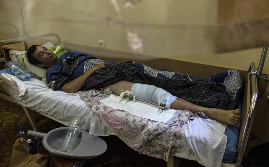 Oleh Hryhorak, 38, at a hospital in Kherson, Ukraine. He said his leg was shattered by shrapnel from a Russian mortar when floodwaters from a collapsed dam began to surround him. 