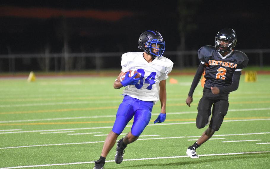 Brussels’ Jabriel Wells looks for an opening during Friday night’s game on the road at Spangdahlem Air Base, Germany. The Brigands won in a nail-biter, 39-36.