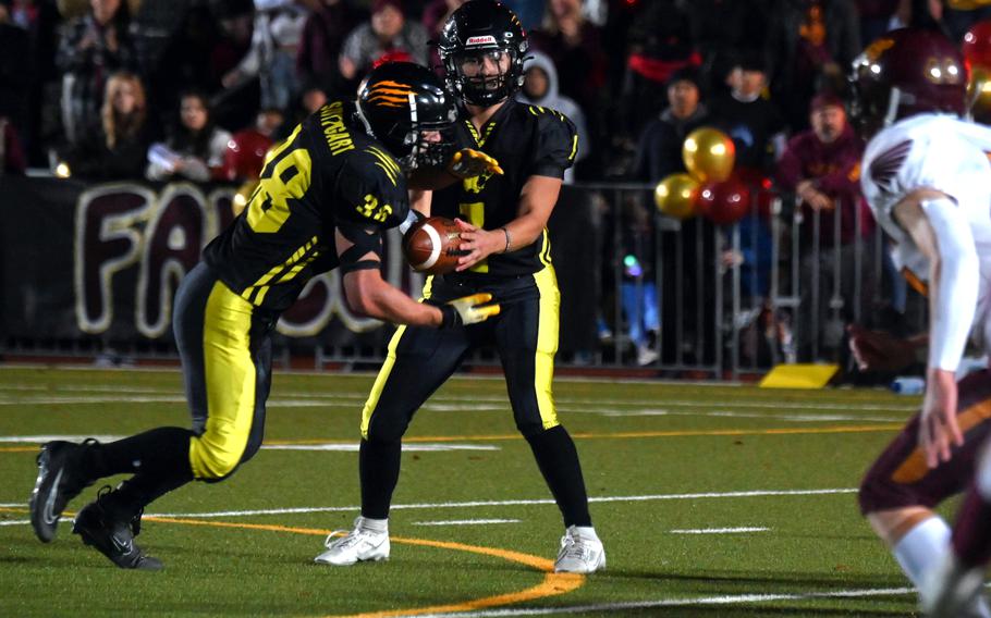 Panther’ quarterback Ty Jones hands the ball off to  Jack Gruver during the Division I championship game against Vilseck on Oct. 28, 2023, at Stuttgart Highschool. Gruver was named DODEA’s European Male Athlete of the Year.