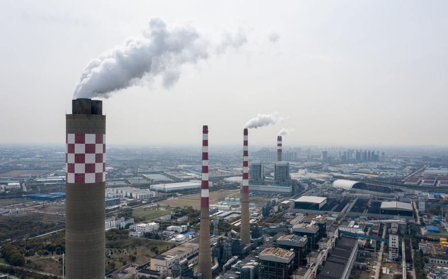 Exhaust rises from the smoke stacks of thermal power plants in this aerial photograph taken in Changshu, Jiangsu Province, China, on March 25, 2020. 