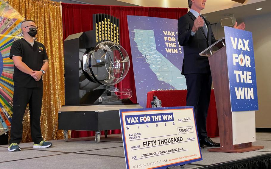 California Gov. Gavin Newsom draws first the 15 winners in the state's Vax for the Win program.