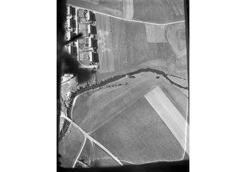 The open bomb bay of the "Bon Bon Bomber," shows the German landscape below. It was the last time that chocolate bars, boxes of lemon drops and other delicious things attached to tiny white parachutes were dropped from the sky as "Operation Little Vittles" ended. 