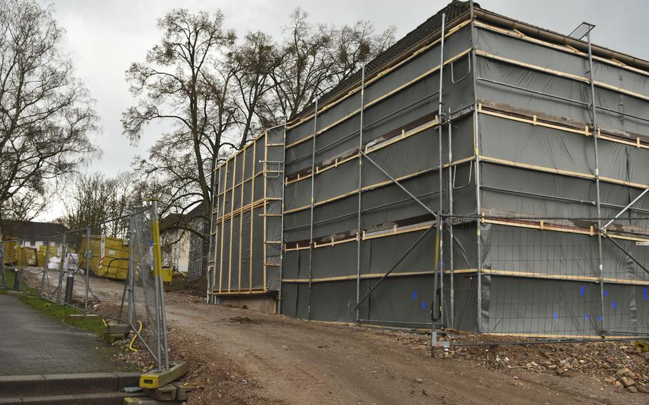 Housing buildings are wrapped with protective barriers during a demolition project in the Army's Crestview neighborhood in Wiesbaden, Germany, on March 11, 2024.