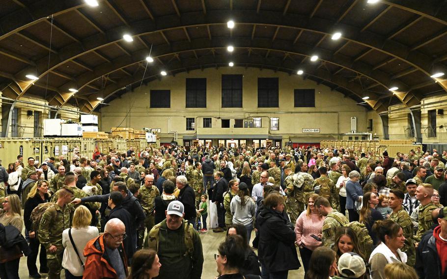 New Hampshire Guard troops reunite with friends and family at a a welcome home ceremony for the 3rd Battalion, 197th Field Artillery Regiment on Feb. 8, 2024, at the Manchester, N.H., armory. 