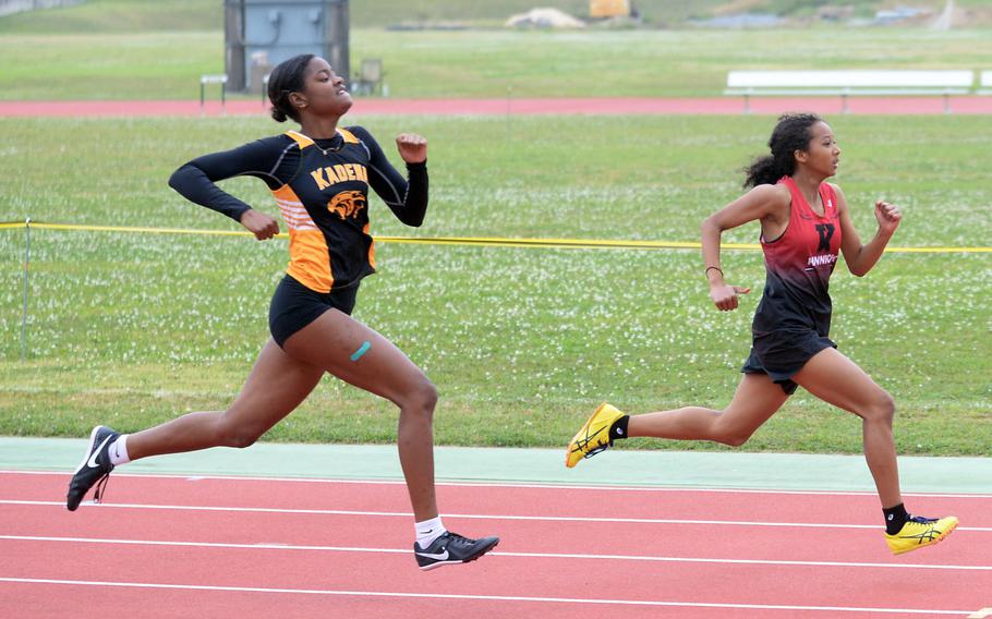 Liza Young and Nina Gaudin run in the 200.