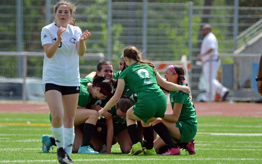 Vicenza’s Caecilia Janssens applauds as the Naples Wildcats celebrate their Division II title after defeating the Cougars 3-1 in the Division II girls final at the DODEA-Europe championships at Ramstein, Germany, May 18, 2023.