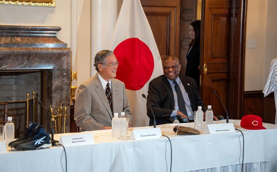 Former San Francisco Giants pitcher Masanori Murakami, left, and former Yomiuri Giants slugger Warren Cromartie show off baseball memorabilia at the U.S. ambassador's residence in Tokyo, April 18, 2024.