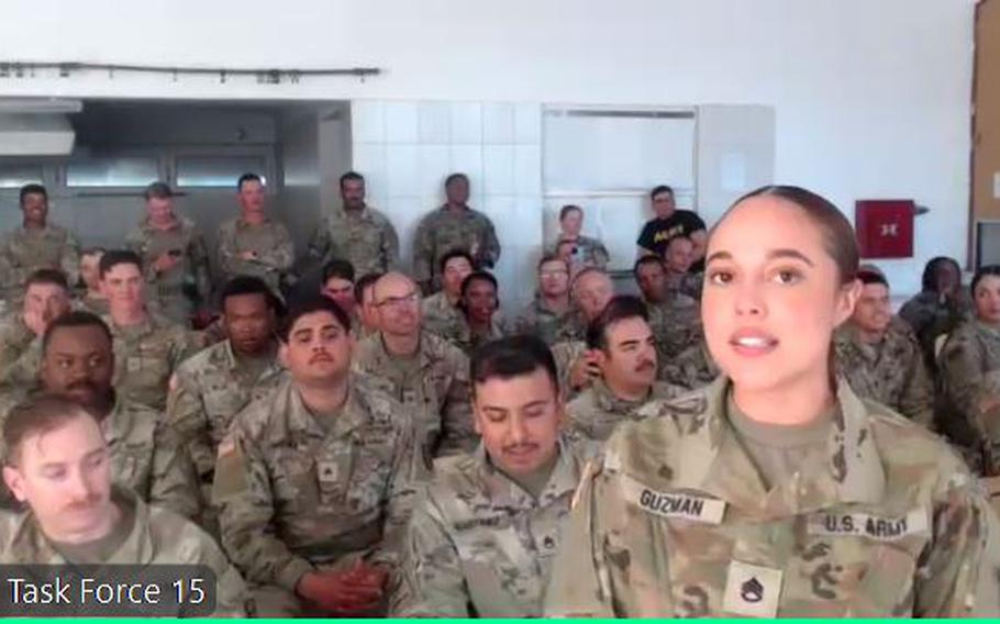 Army Staff Sgt. Selena Guzman, a construction supervisor with Task Force 15 in North Macedonia, speaks to actors Jennifer Lopez, Sterling K. Brown and Simu Liu during a video call organized by the USO on May 5, 2024.  