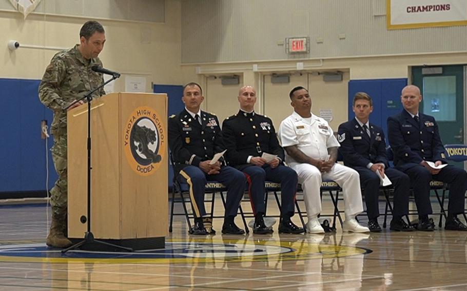 Col. Andrew Roddan, commander of the 374th Airlift Wing, encourages Yokota High School students to strive for their education, during a ceremony at Yokota Air Base, Japan, May 11, 2023. 