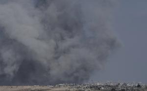 Smoke from Israeli bombardment of the northern Gaza Strip near the Israel-Gaza border, seen from southern Israel, Monday, July 14, 2025. (AP Photo/Maya Alleruzzo)