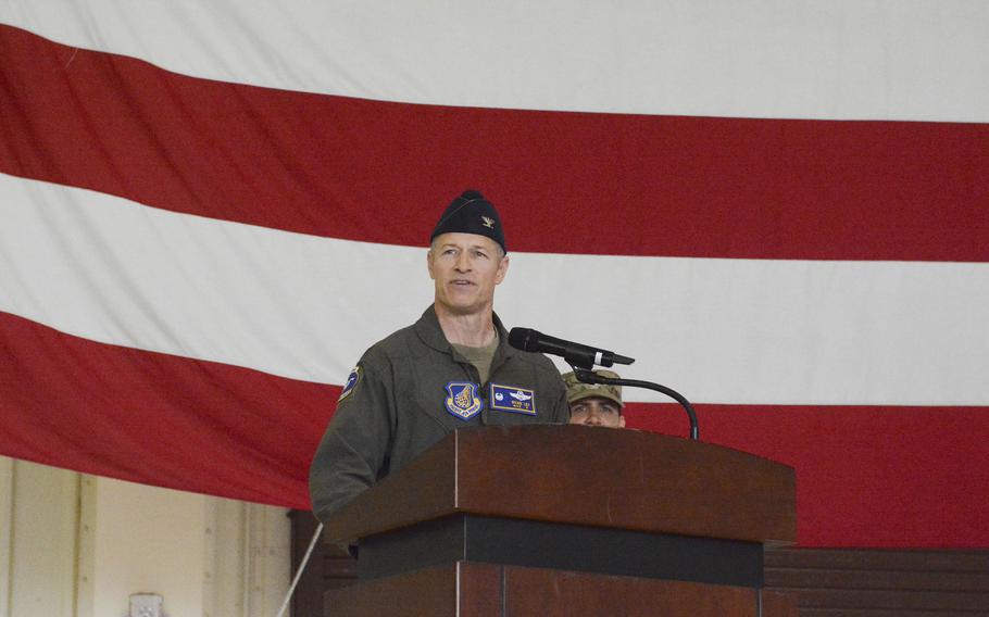 Air Force Col. Ryan Ley stands behind a podium and speaks at a change-of-command ceremony at Osan Air Base, South Korea, June 27, 2025.
