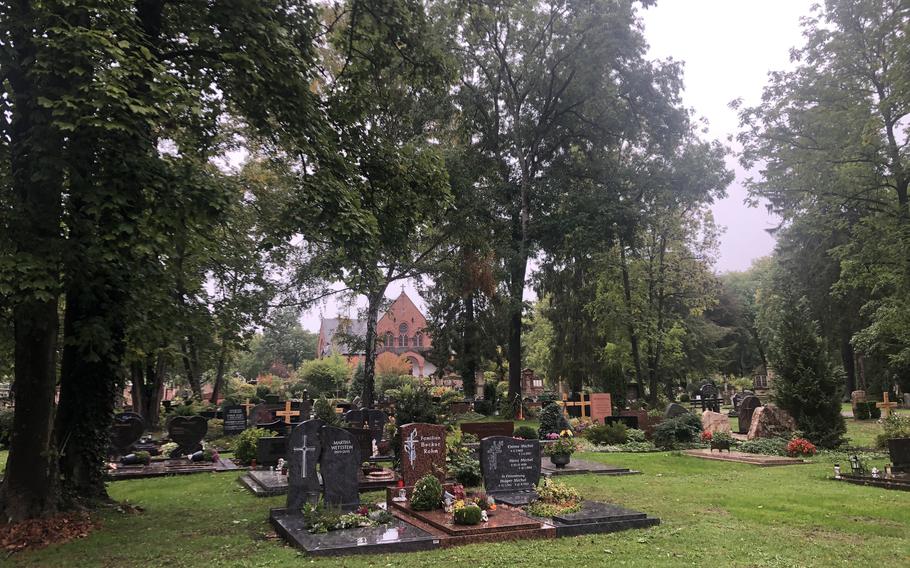 The chapel is seen in the background at the main cemetery in Kaiserslautern, Germany, on a rainy October day.