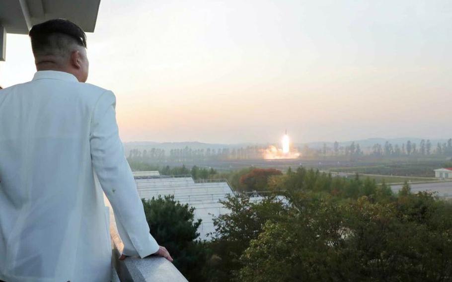 North Korean leader Kim Jong Un watches a missile launch in this image released by the state-run Korean Central News Agency on Oct. 10, 2022.