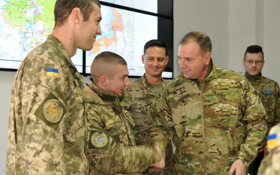 Lt. Gen. Ben Hodges shakes the hand of a Ukrainian soldier in Yavoriv, Ukraine, Nov. 5, 2016. Hodges, who is retired,  was the commander of U.S. Army Europe and recently signed a open letter with others calling for a limited no-fly zone over Ukraine.