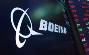 The logo for Boeing appears on a screen above a trading post on the floor of the New York Stock Exchange, July 13, 2021. China's Ministry of Commerce announced sanctions against Boeing and two other defense companies Monday, May 20, 2024, for arms sales to Taiwan, on the day of Taiwan's presidential inauguration.