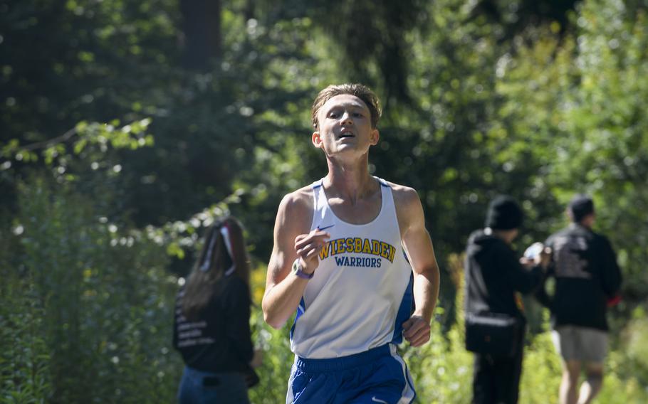 Zach Watts, a runner for Wiesbaden, goes all out during the finish of a high school boys’ varsity cross country race Saturday, Sept. 18, 2021, in Kaiserslautern, Germany.